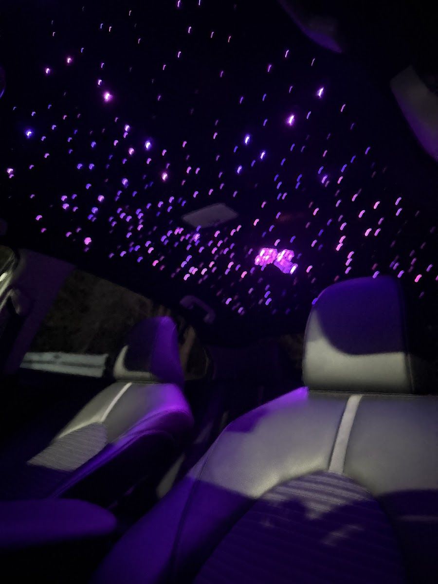 Finished fiber-optic starlight headliner lit at night