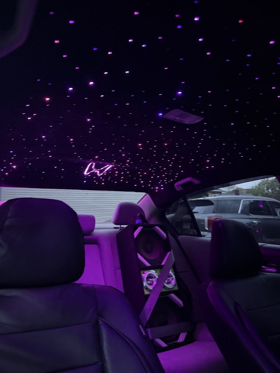 Starlight headliner glowing above the steering wheel